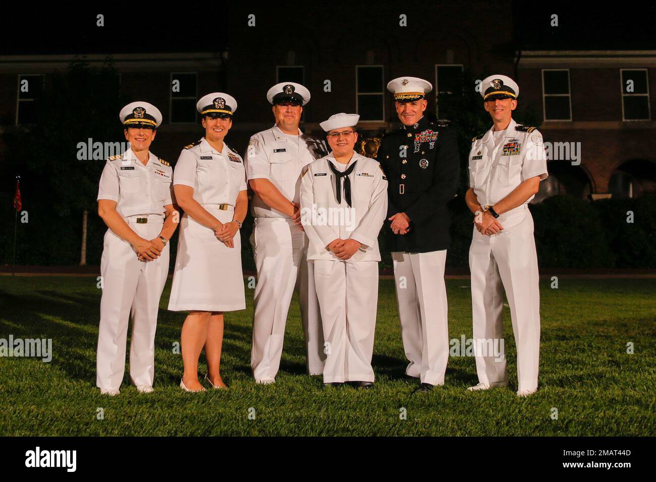 U.S. Marine Corps Maj. Gen. Jason Q. Bohm, Commanding General of Marine Corps Recruiting Command, stands with Naval Officers and a Sea Cadet from the Alexandria, Va., Sea Cadet Division at the Evening Parade at Marine Barracks Washington, on June 3, 2022. Bohm, a former member of the Sea Cadets, accompanied the group to the 'Oldest Post in the Corps' so they could see firsthand the proficiency and discipline of the Marine Corps. Stock Photo