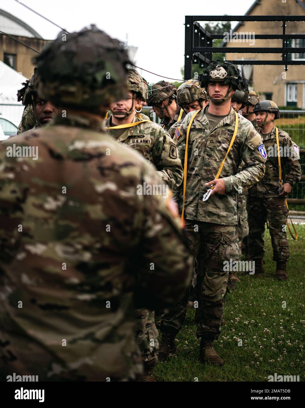 A U.S. Army paratrooper assigned to the 173rd Airborne Brigade watches a jumpmaster for jump