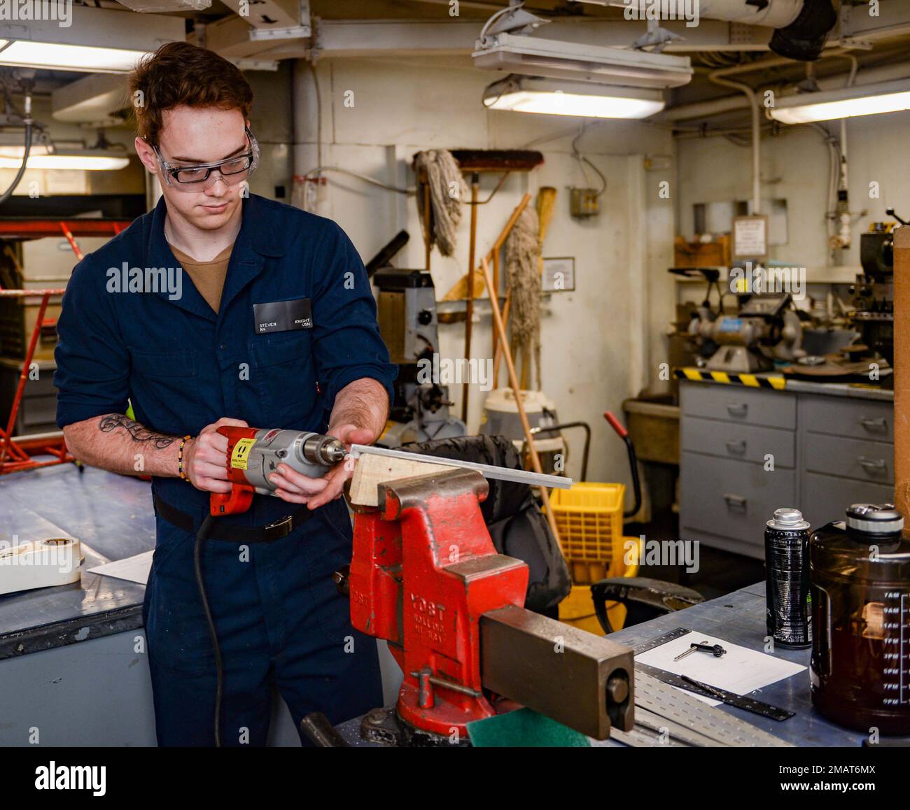 220604-N-FB730-1006 IONIAN SEA (June 4, 2022) Airman Steven Knight, from Charlotte, North Carolina, drills a hole in a hinge for a placard in the airframe shop aboard USS Harry S. Truman (CVN 75), June 4, 2022. The Harry S. Truman Carrier Strike Group is on a scheduled deployment in the U.S. Naval Forces Europe area of operations, employed by U.S. Sixth Fleet to defend U.S., Allied and Partner interests. Stock Photo