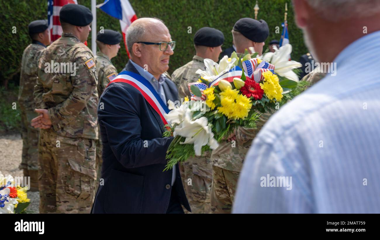 Chantal Lelievre, mayor of La Haye, France carries a wreath to the