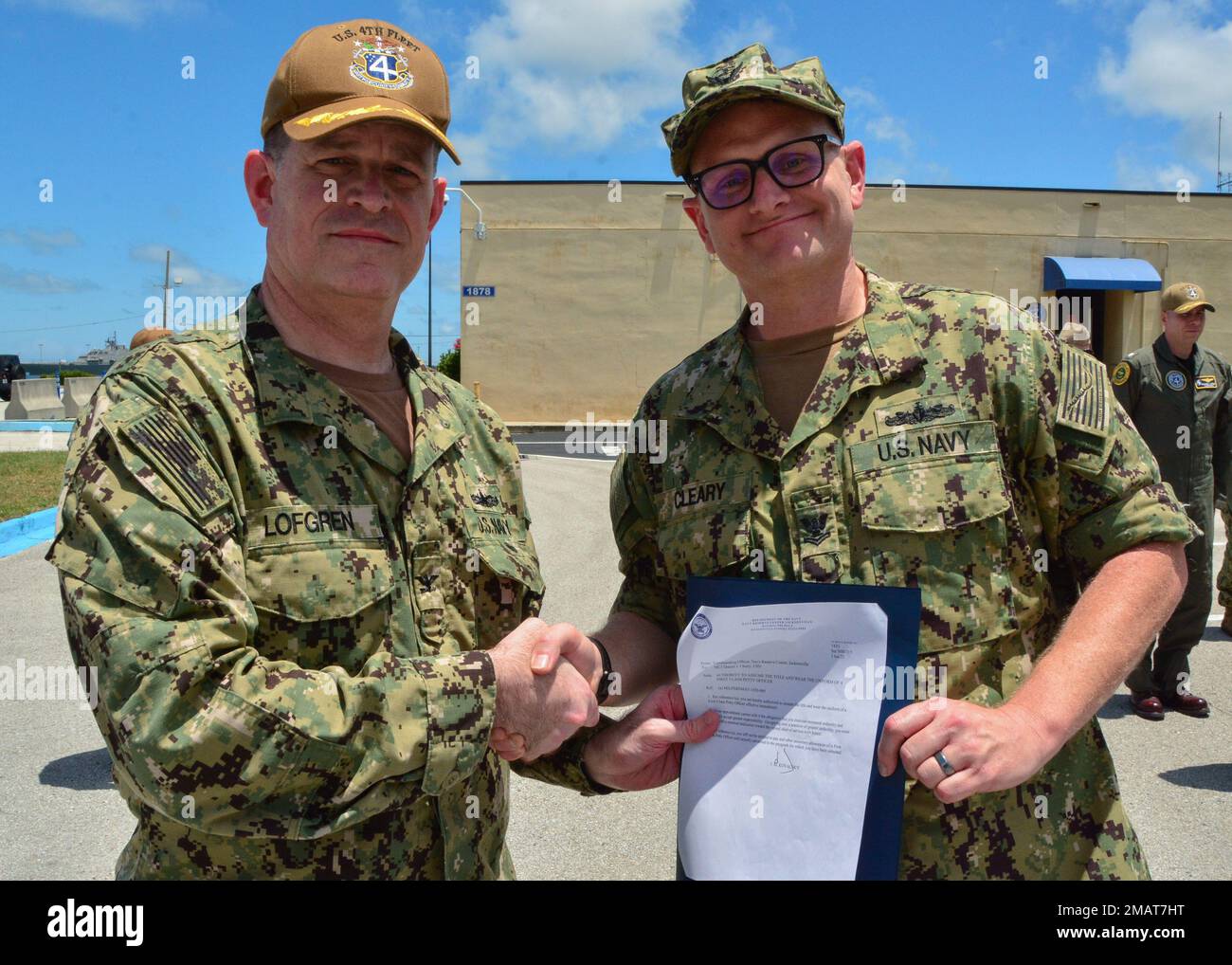 220604-N-RL456-0006  MAYPORT, Fla. (June 4, 2022) Mass Communication Specialist Daniel Cleary, a native of Indianapolis, Ind. and resident of Jacksonville, Fla., is presented a frocking letter prior to being advanced to first class petty officer by Capt. Richard S. Lofgren, commanding officer, U.S. Naval Forces Southern Command/U.S. 4th Fleet reserve component, June 4, 2022. “Making first class is such a big honor to me because it means the Navy sees what I have done during my service and thinks I’m ready for more,” said Cleary. U.S. Naval Forces Southern Command/U.S. 4th Fleet supports U.S. S Stock Photo