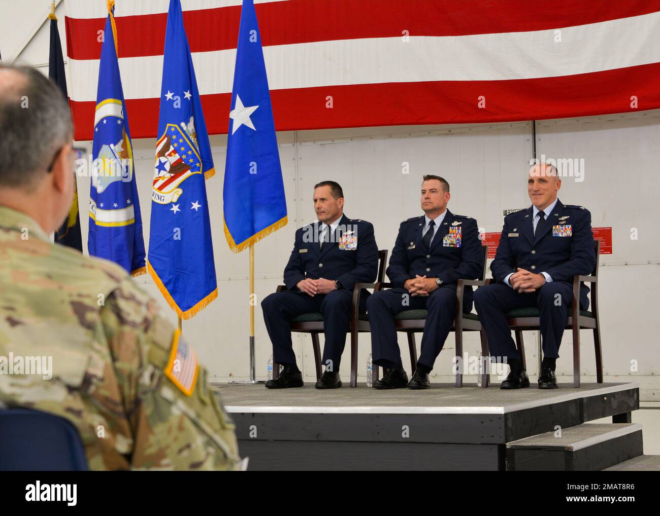 Michigan Air National Guard leadership sit on stage during a 110th Wing change of command