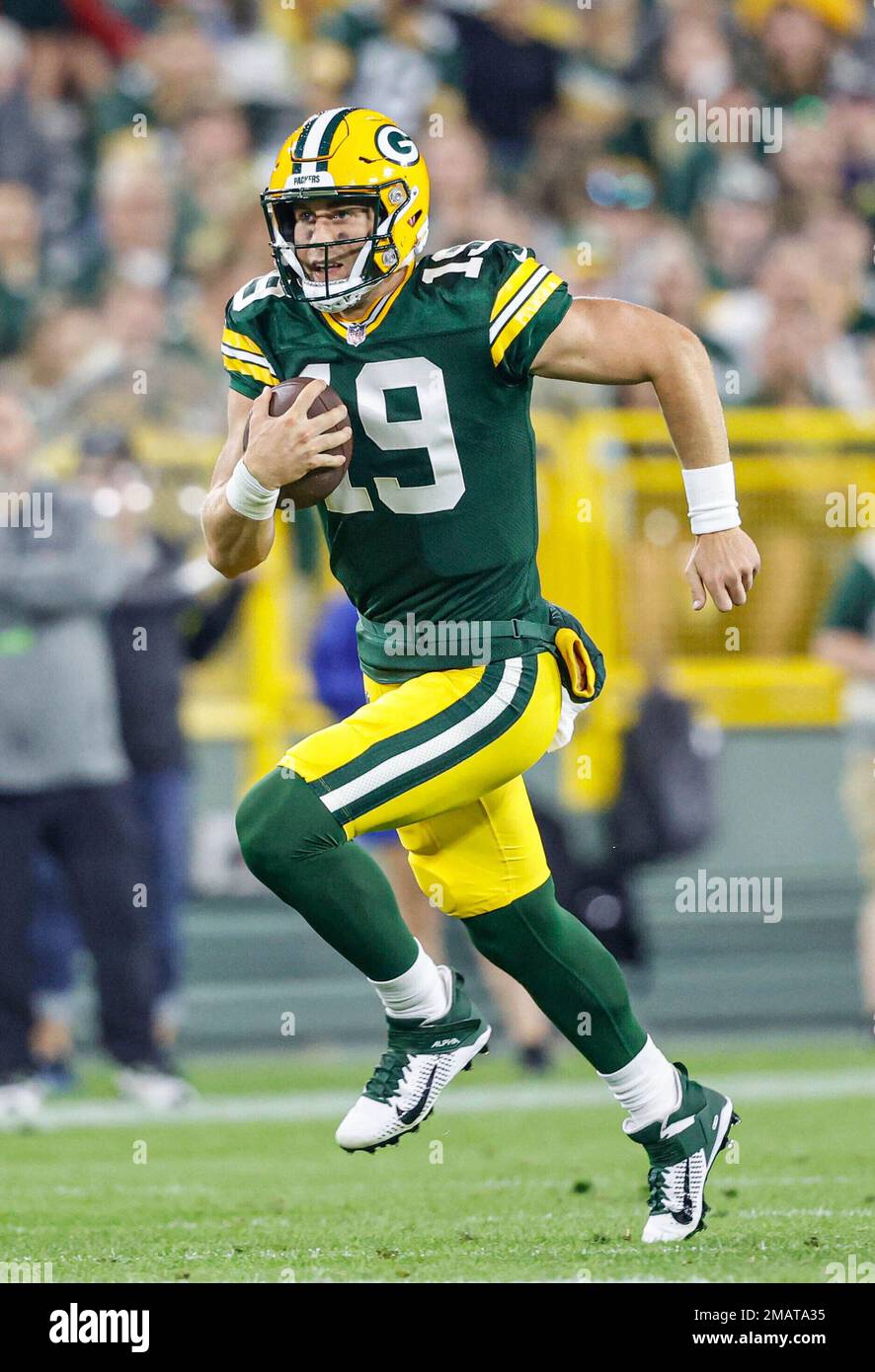 Green Bay Packers quarterback Danny Etling (19) runs for a touchdown during  an NFL Preseason game against the New Orleans Saints Friday, Aug. 19, 2022,  in Green Bay, Wis. (AP Photo/Jeffrey Phelps