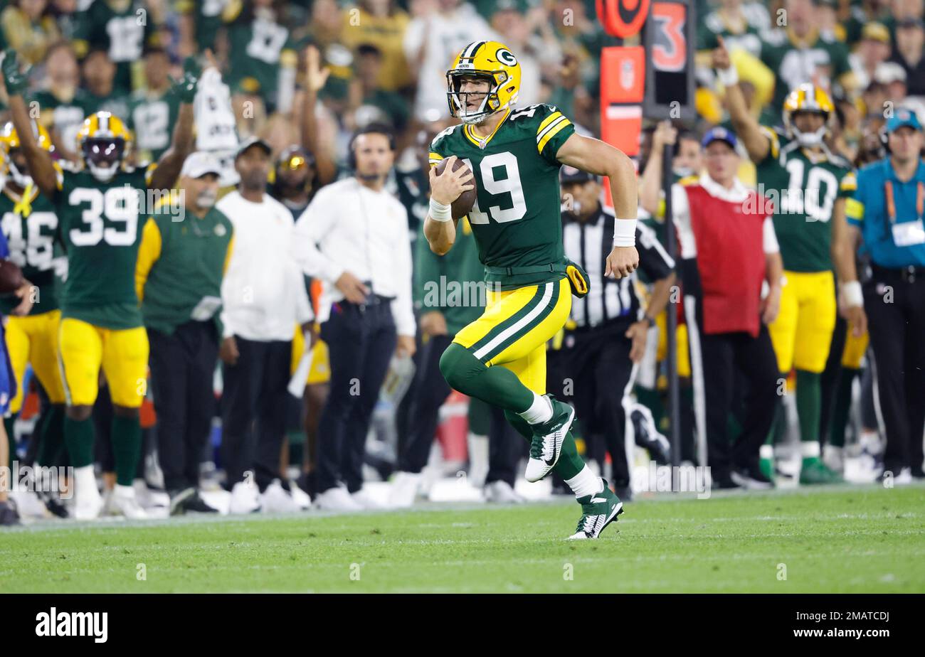 Green Bay Packers quarterback Danny Etling (19) runs for a touchdown during  an NFL Preseason game against the New Orleans Saints Friday, Aug. 19, 2022,  in Green Bay, Wis. (AP Photo/Jeffrey Phelps