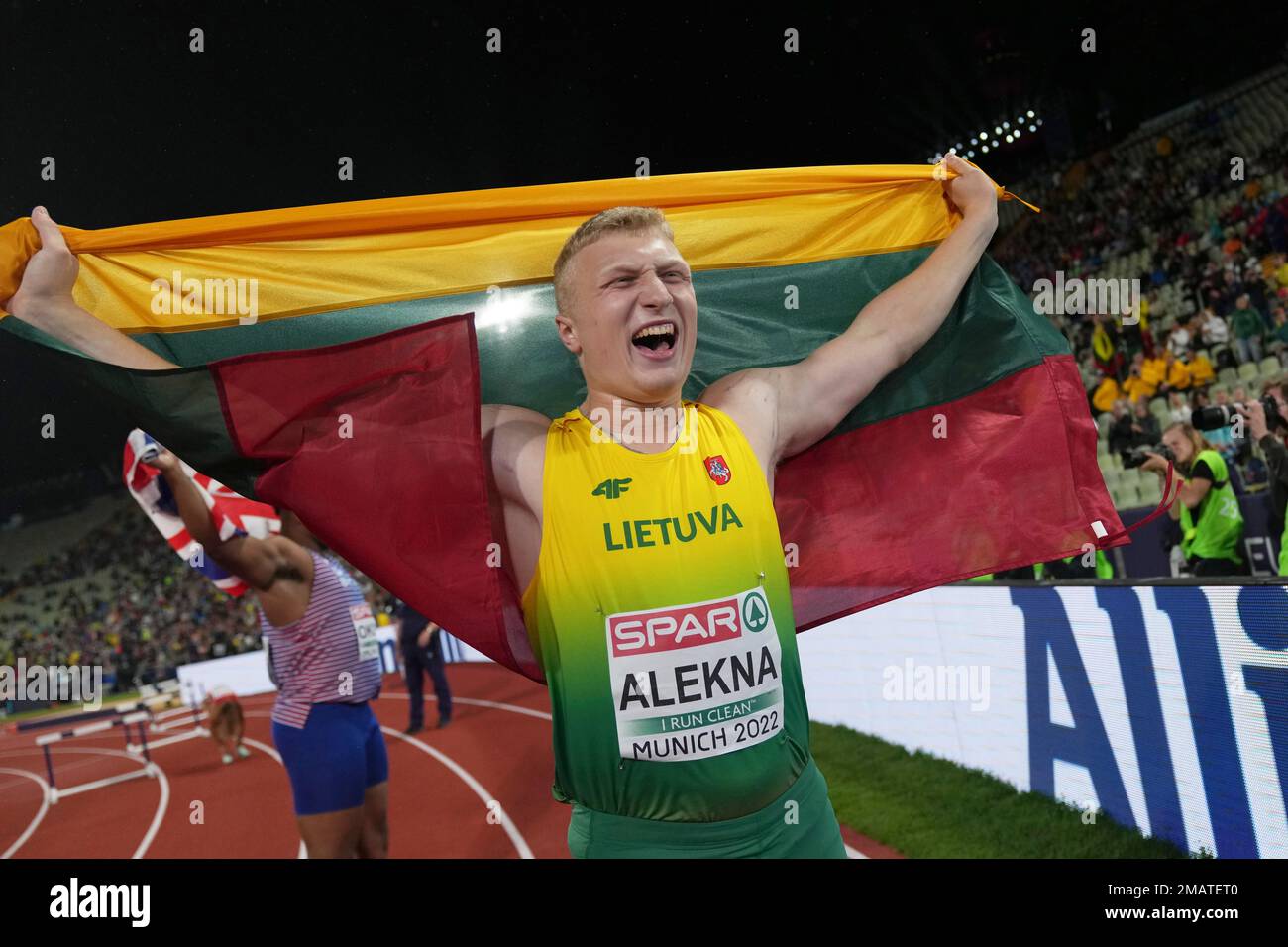 Mykolas Alekna, of Lithuania, celebrates after winning the gold medal