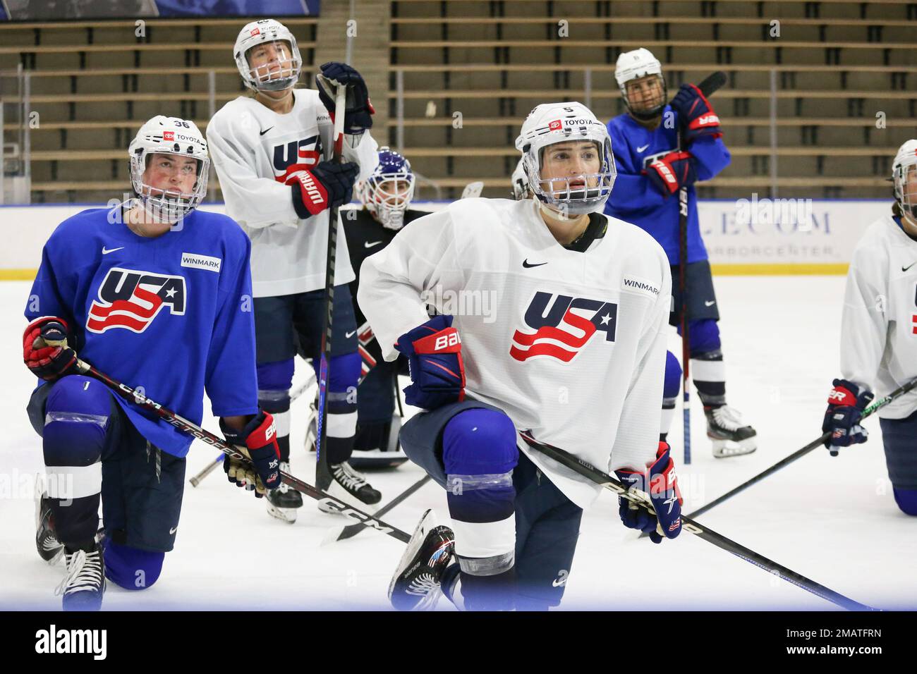 Members of the United States womens hockey team including Megan Keller (5) and Rory Guilday (36) listen in on a team meeting during practice at the Lecom Harborcenter rink in Buffalo, N.Y.,