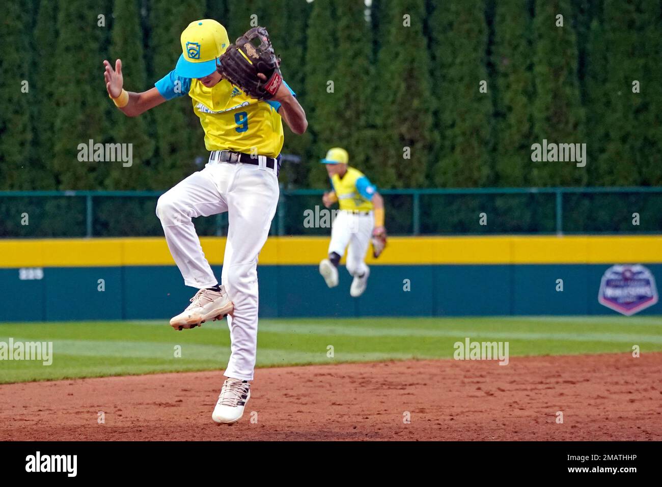 Puerto Rico second baseman Sebastian Cruz (9) turns a double play