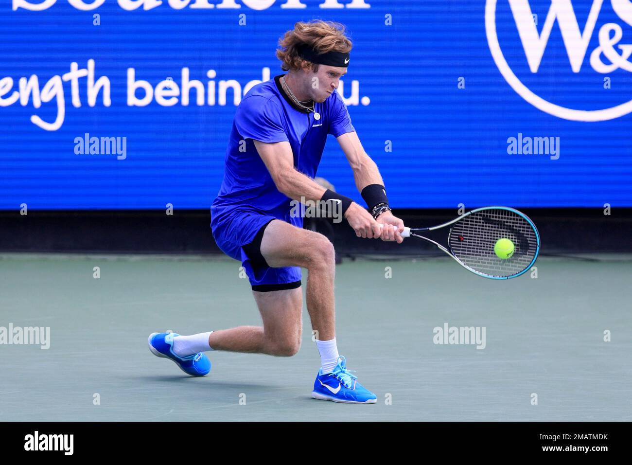 Andrey Rublev, of Russia, returns a shot to Taylor Fritz, of the United States, during the Western and Southern Open tennis tournament, Thursday, Aug