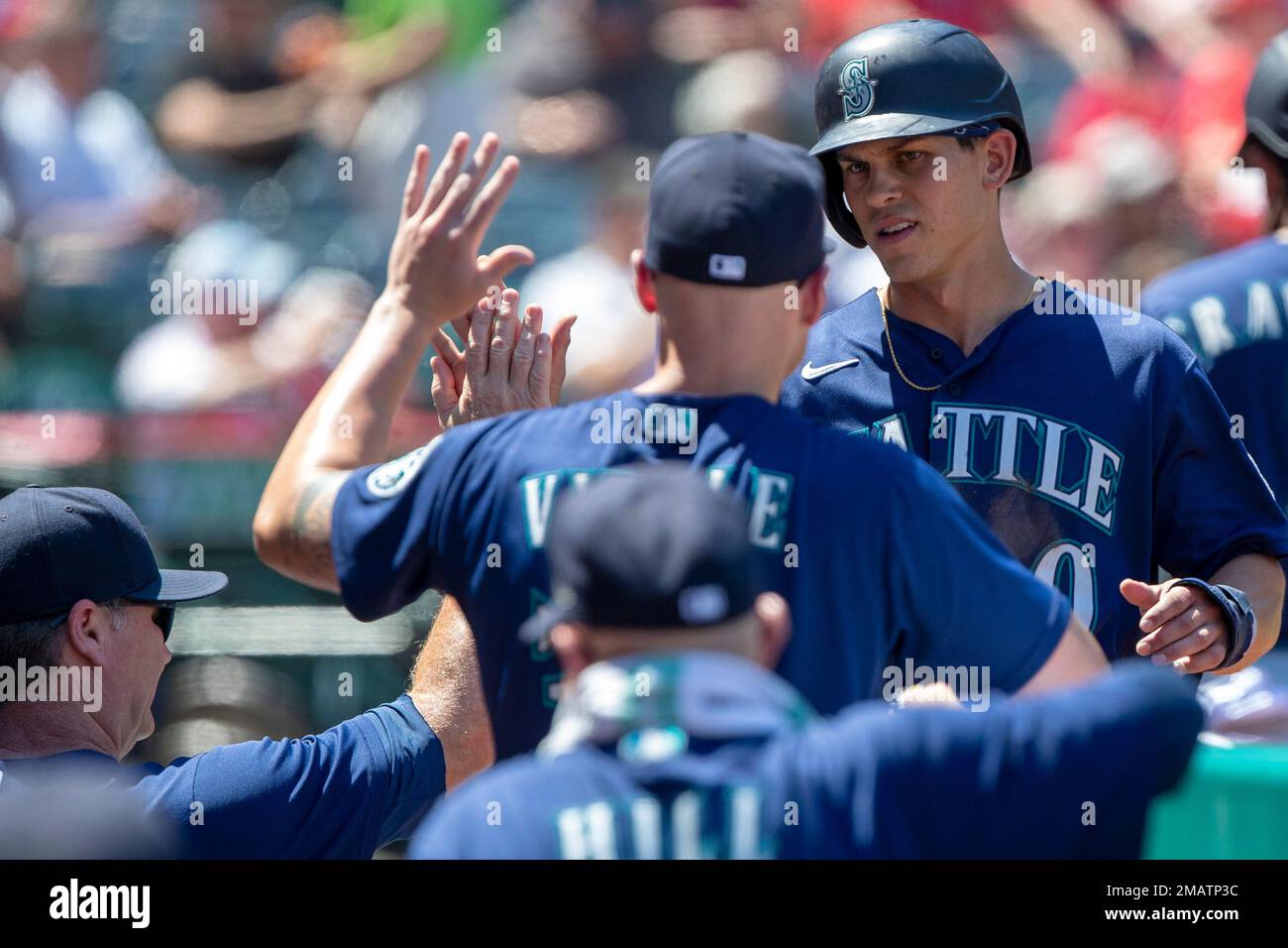 Seattle Mariners' Sam Haggerty, right, gets congratulations from