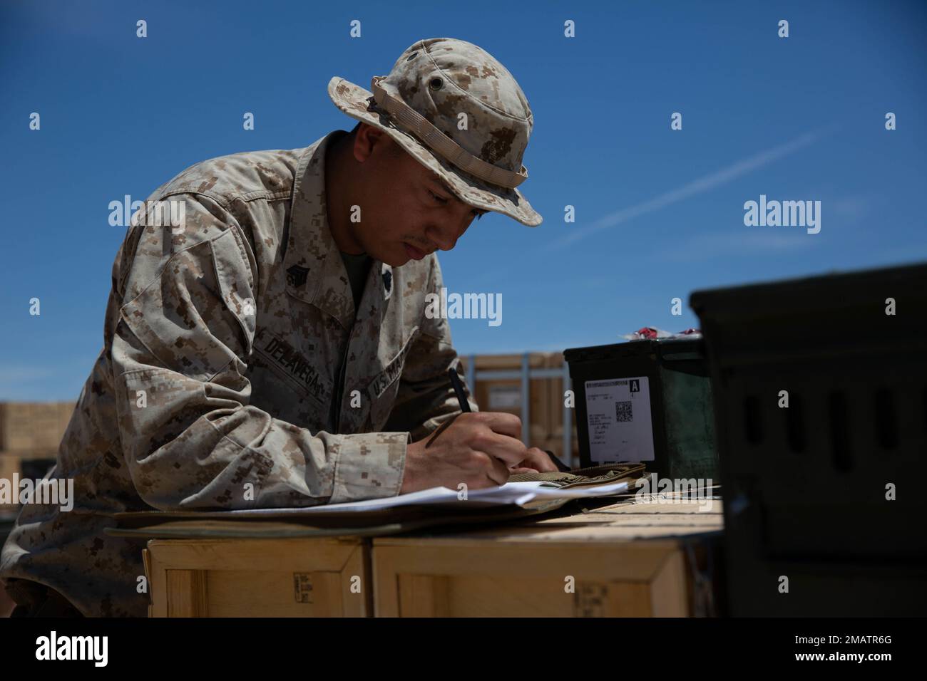 U.S. Marine Corps Sgt. Glenn Delavega, an ammunition technician with Combat Logistics Battalion 13, 13th Marine Expeditionary Unit, inspects and verifies ammunition in preparation for an upcoming range during Realistic Urban Training exercise at Marine Corp Air Ground Combat Center Twentynine Palms on June 4, 2022. The 13th MEU is currently conducting RUT exercise to enhance the integration and collective capability of the MEU’s command, air, ground, and logistics elements and prepare the 13th MEU to meet the nation’s crisis response needs during their upcoming overseas deployment. Stock Photo