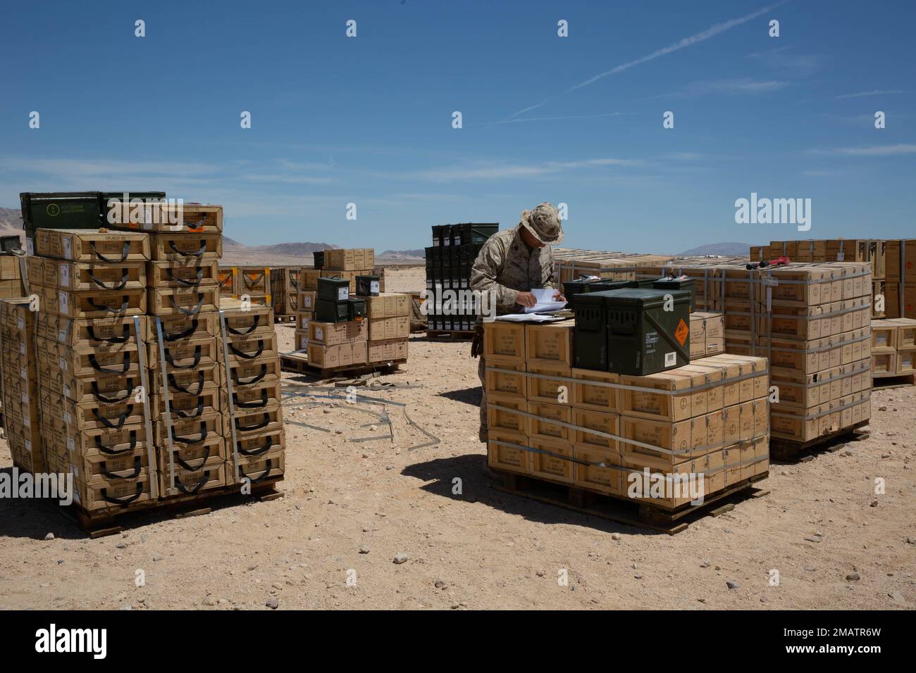 U.S. Marine Corps Sgt. Glenn Delavega, an ammunition technician with Combat Logistics Battalion 13, 13th Marine Expeditionary Unit, inspects and verifies ammunition in support of an upcoming range during a Realistic Urban Training exercise at Marine Corp Air Ground Combat Center Twentynine Palms on June 4, 2022. The 13th MEU is currently conducting RUT exercise to enhance the integration and collective capability of the MEU’s command, air, ground, and logistics elements and prepare the 13th MEU to meet the nation’s crisis response needs during their upcoming overseas deployment. Stock Photo