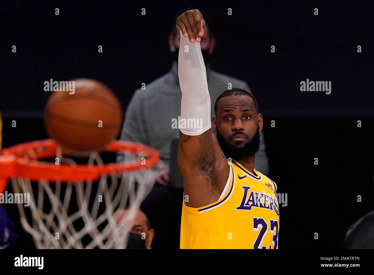 Los Angeles Lakers forward LeBron James (23) points at a team mate during  the second half of an NBA basketball game against the Portland Trail  Blazers Friday, Feb. 26, 2021, in Los