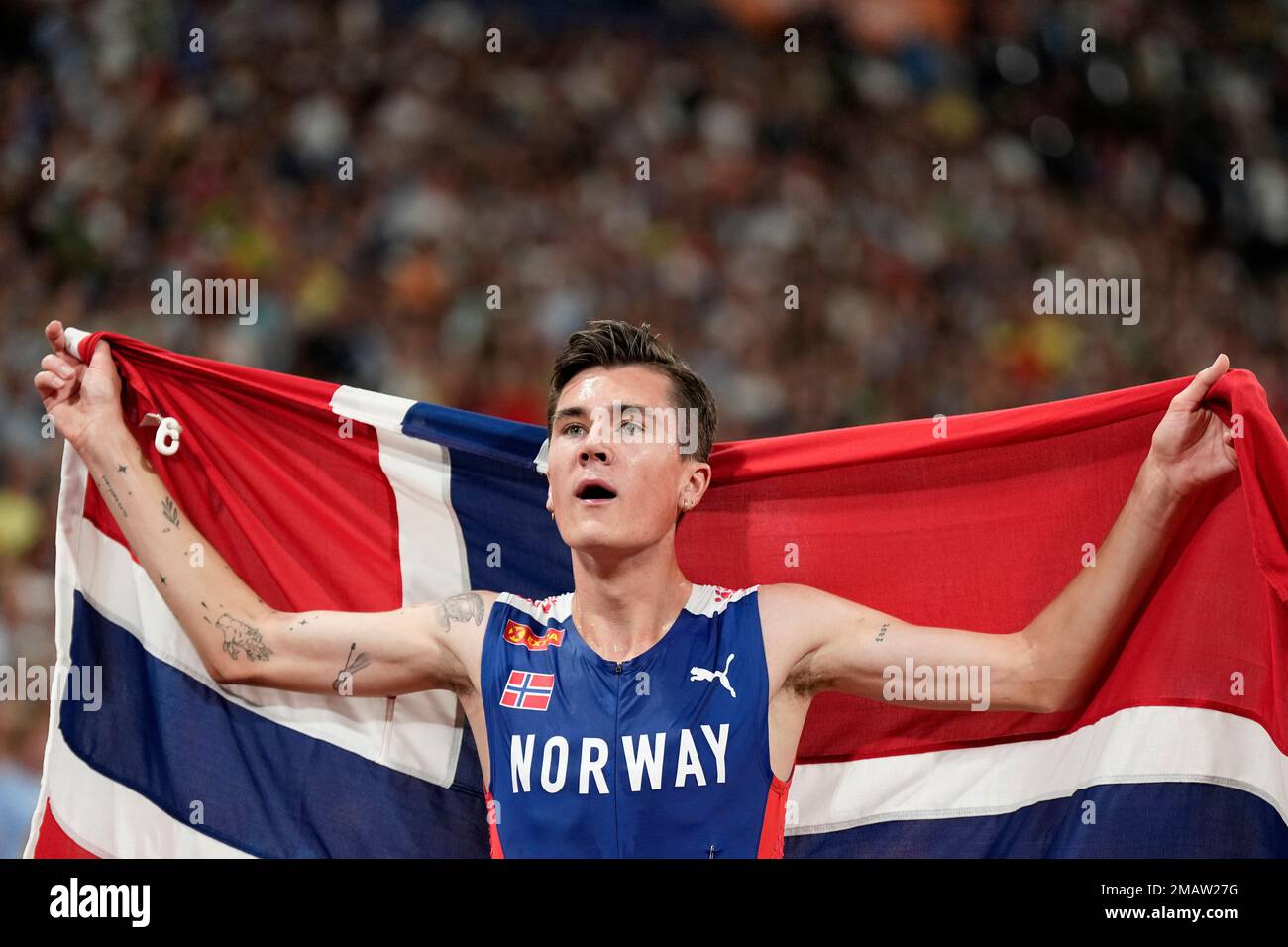 Jakob Ingebrigtsen, of Norway, celebrates after winning the gold medal