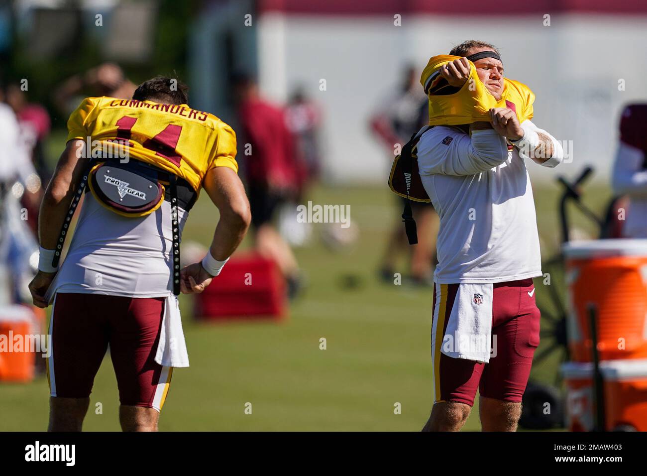 Washington Commanders quarterbacks Sam Howell, left, and Taylor
