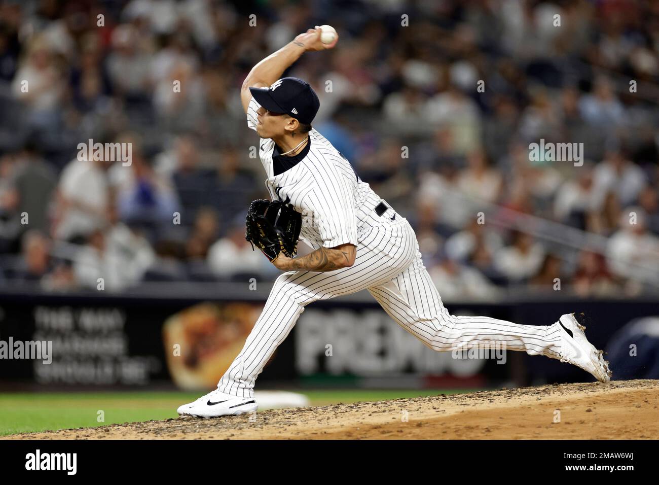 New York Yankees pitcher Jonathan Loaisiga (43) throws during the seventh  inning of a baseball game against the Tampa Bay Rays on Monday, Aug. 15,  2022, in New York. The Rays won