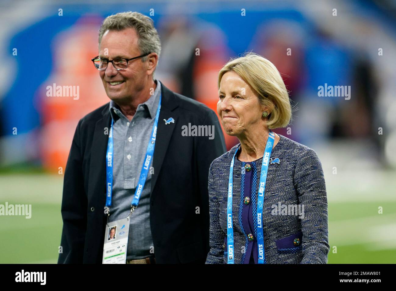 Detroit Lions owner Sheila Ford Hamp and her husband Steve walk on the