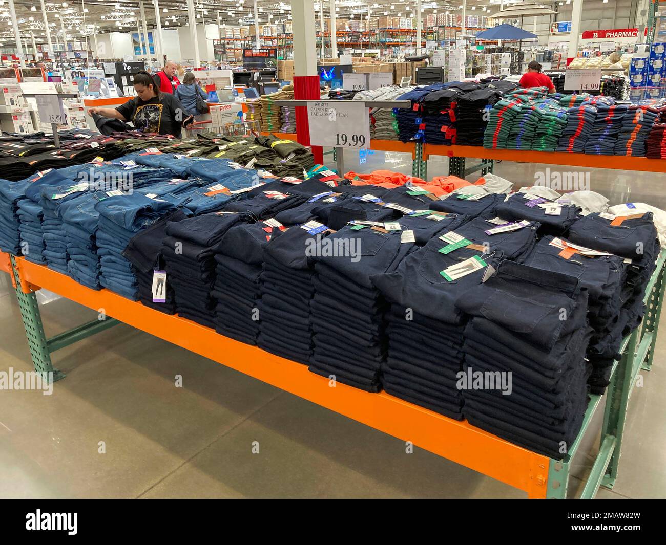 Shoppers peruse jeans on display in a Costco warehouse Monday, Aug. 15