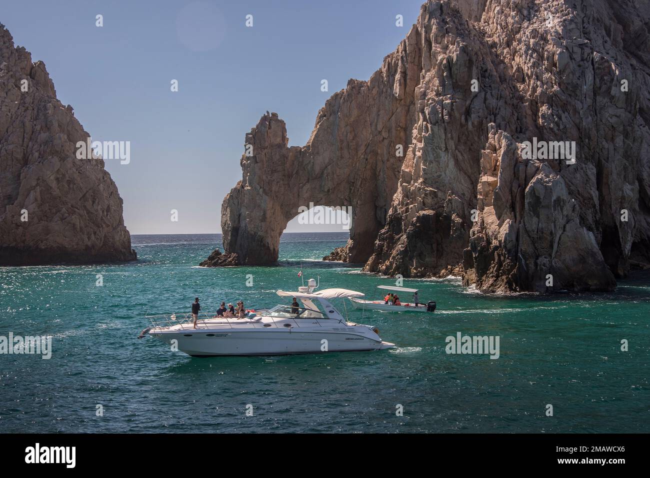 The Cabo Arch is perhaps the most famous landmark in Cabo San Lucas, Mexican Riviera, Mexico. It is only reachable via boat and sits at Land's End. Stock Photo
