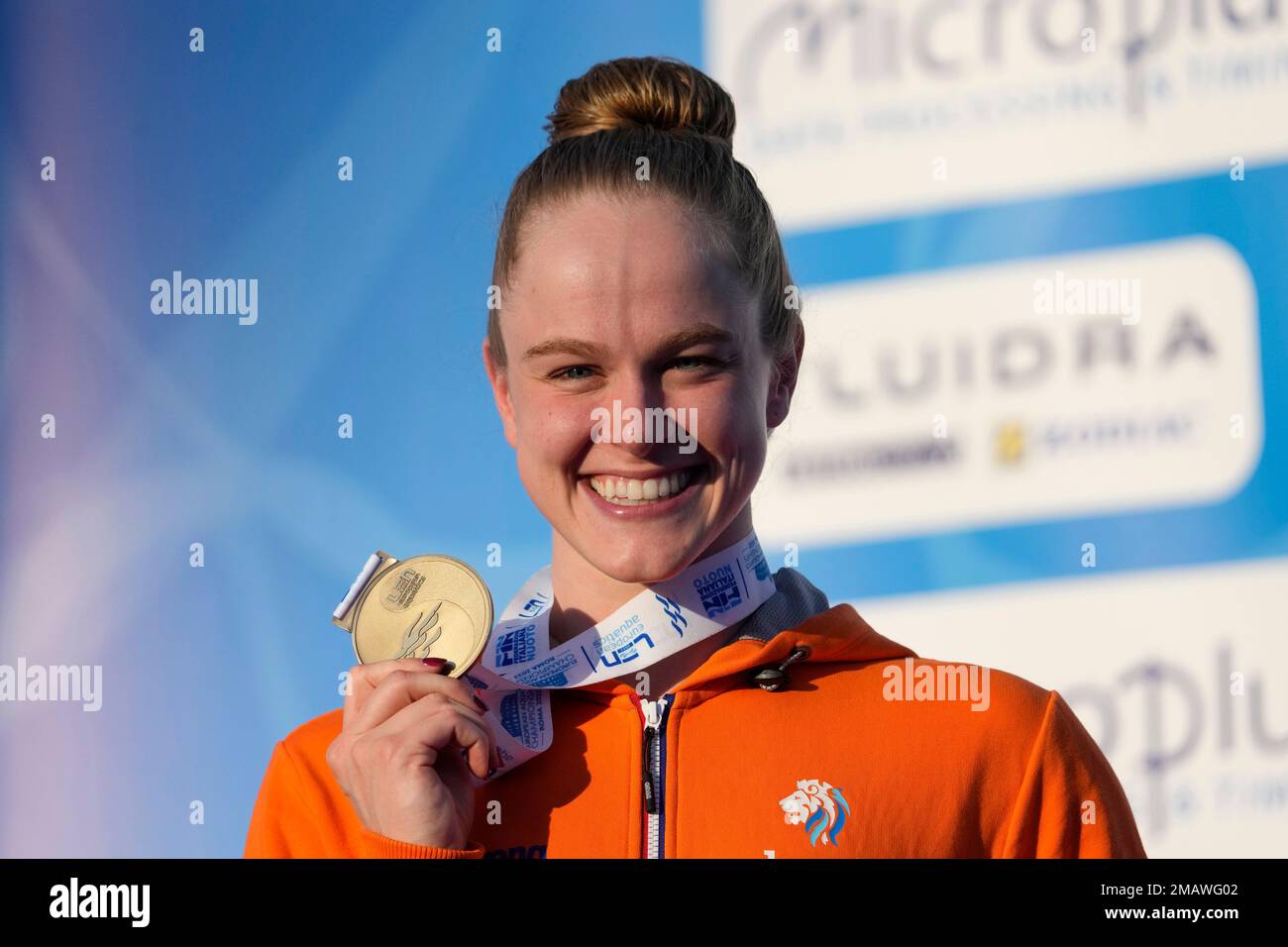 The Netherlands' Maaike De Waard celebrates on the podium after winning