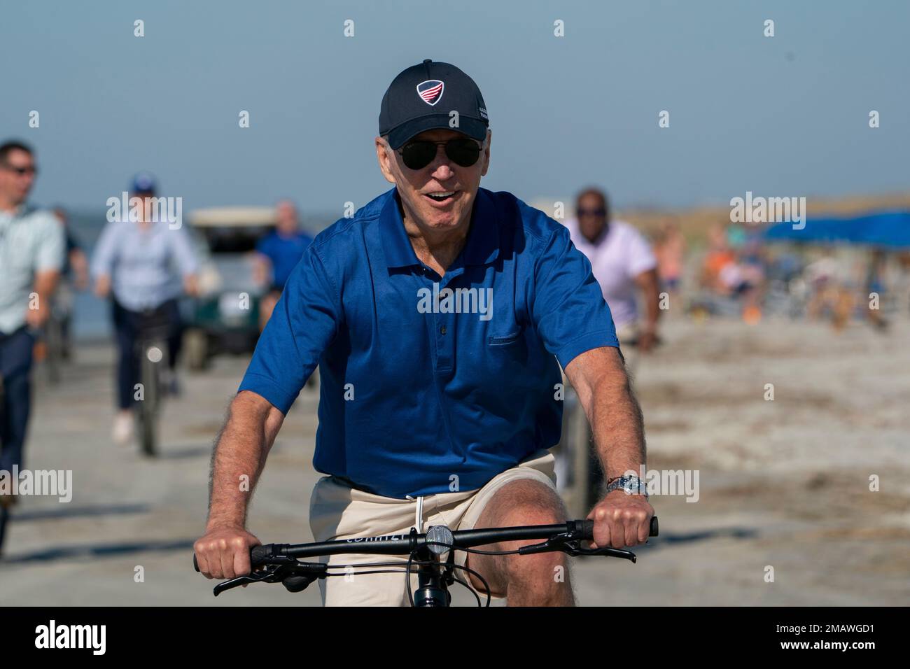 President Joe Biden rides a bicycle along the beach at Kiawah Island, S