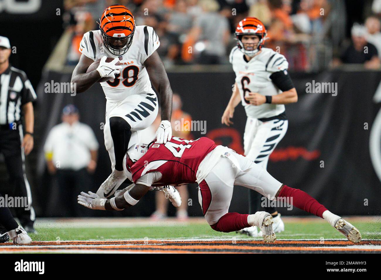 Cincinnati Bengals' running back Jacques Patrick, left, scores a touchdown  against Miami Dolphins' cornerback Jomal Wiltz (33) during an NFL preseason  football game in Cincinnati, Sunday, Aug. 29, 2021. The Dolphins won