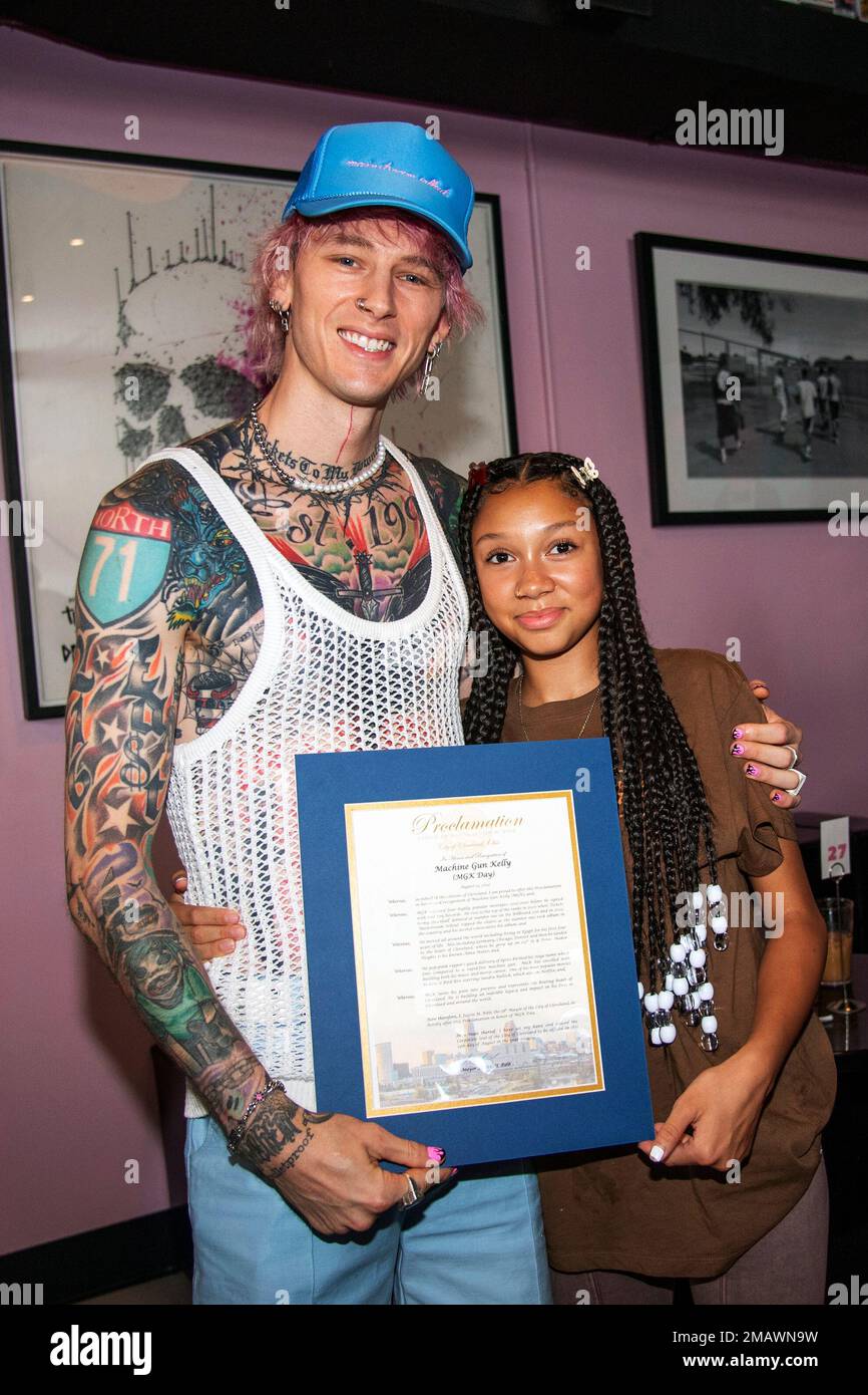 Machine Gun Kelly, left, and Casie Colson Baker pose at MGK Day at 27