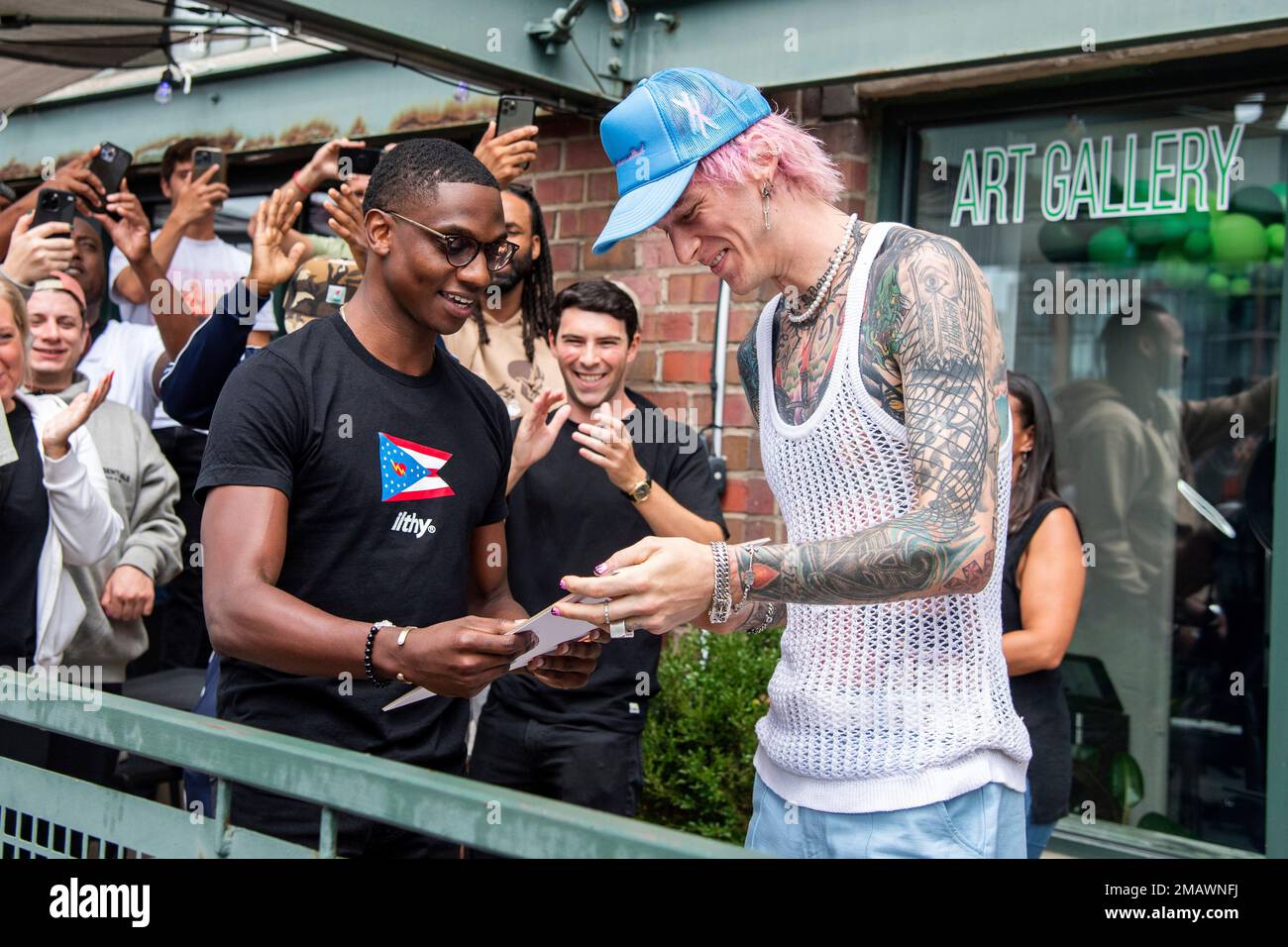 City of Cleveland Mayor Justin M. Bibb, left, and Machine Gun Kelly are