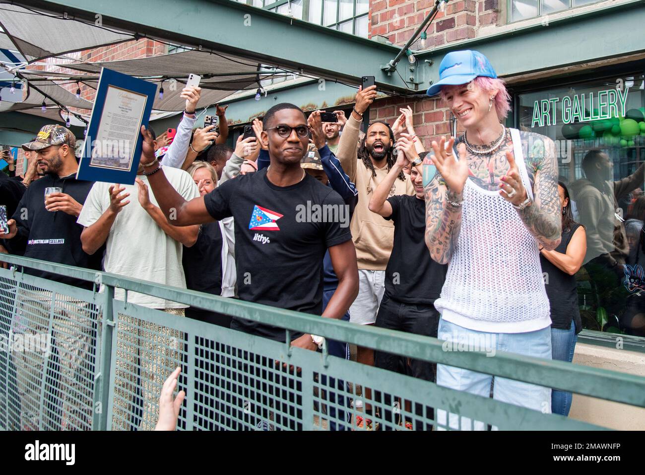 City of Cleveland Mayor Justin M. Bibb, left, and Machine Gun Kelly are