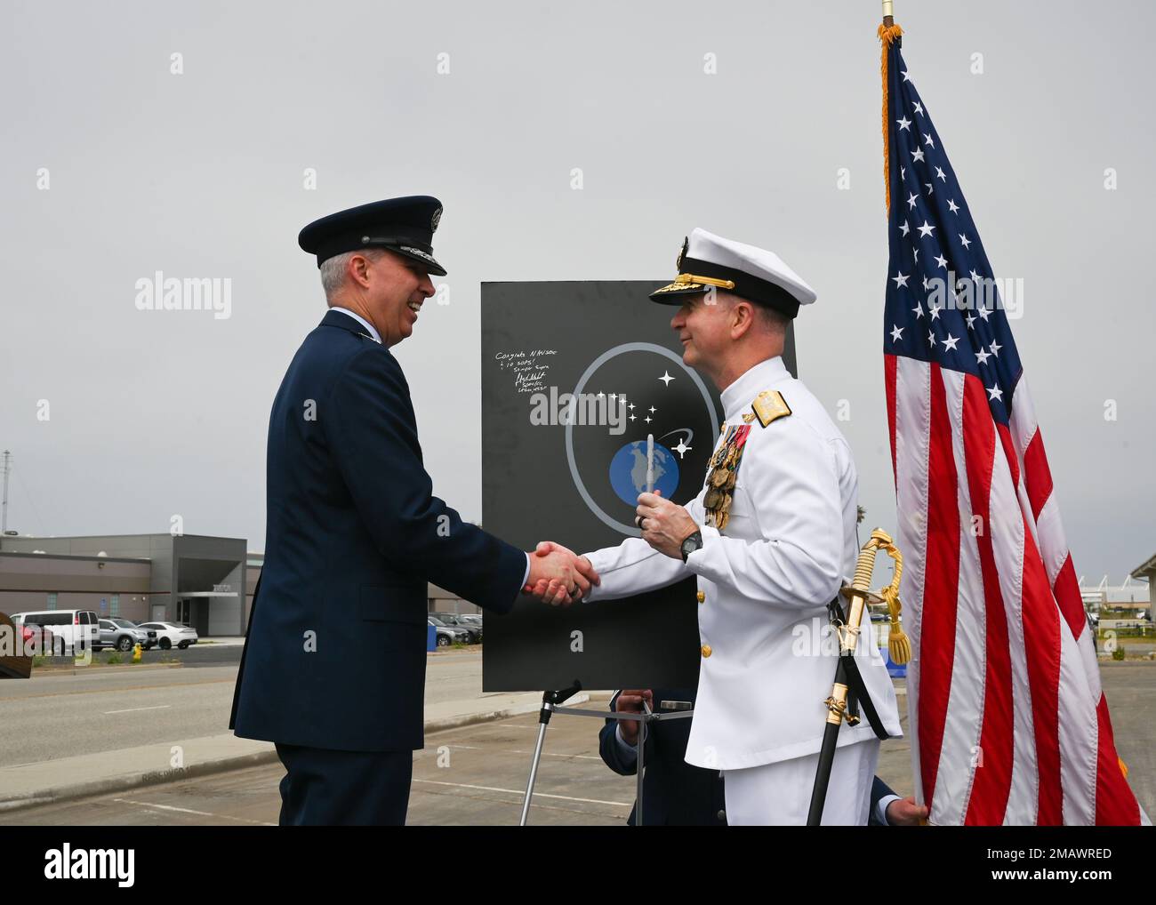 Lt. Gen. Stephen N. Whiting, Space Operations Command commander, shakes hands with Vice Adm. Ross Myers, U.S. Fleet Cyber Command/U.S. Tenth Fleet commander, at the activation ceremony for the 10th Space Operations Squadron at Point Mugu, California, June 6, 2022. 10 SOPS will fall under Space Operations Command’s satellite communication delta, DEL8, and perform the mission formerly fulfilled by the Naval Satellite Operations Center, which was disestablished the same day. Stock Photo