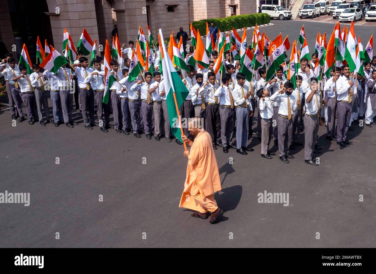 Uttar Pradesh state Chief Minister Yogi Adityanath walk with an Indian ...