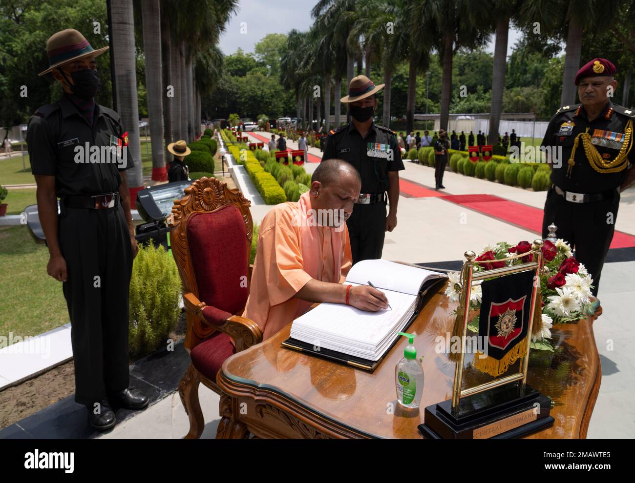 Uttar Pradesh Chief Minister Yogi Adityanath signs the visitors book ...