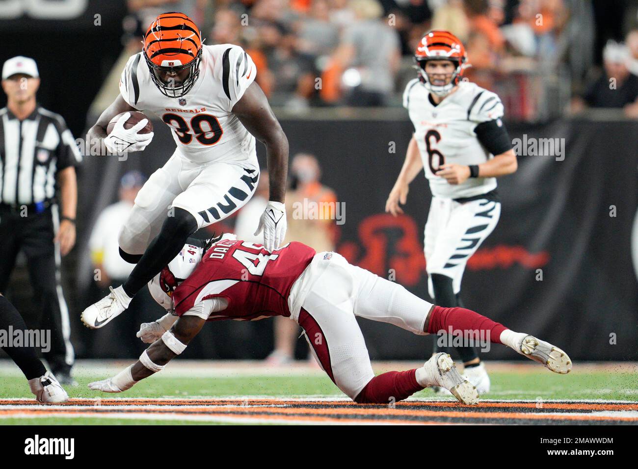 Cincinnati Bengals' running back Jacques Patrick, left, scores a touchdown  against Miami Dolphins' cornerback Jomal Wiltz (33) during an NFL preseason  football game in Cincinnati, Sunday, Aug. 29, 2021. The Dolphins won