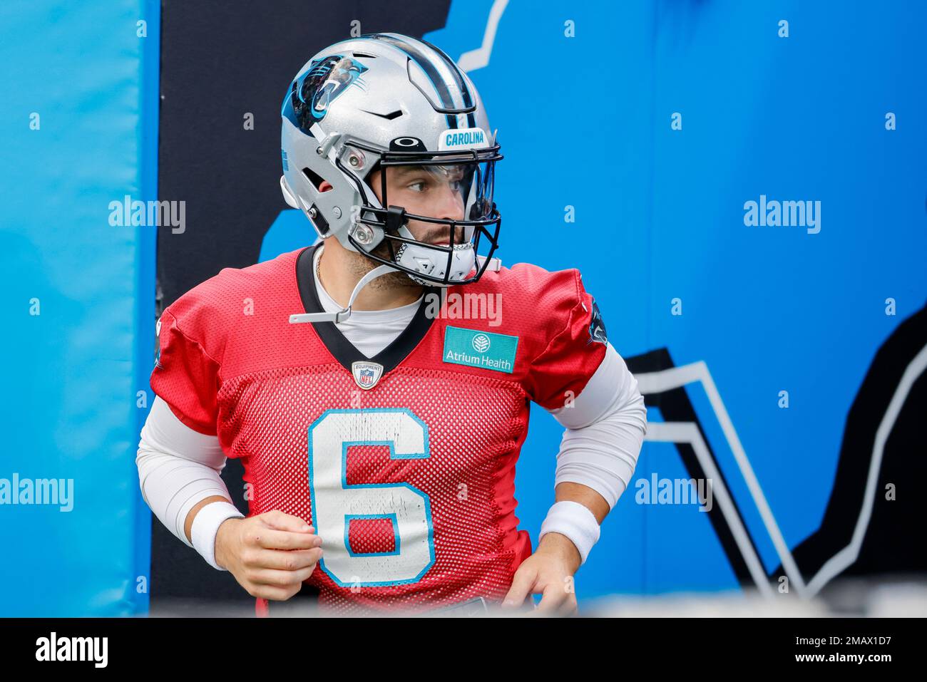 Carolina Panthers quarterback Baker Mayfield runs onto the field at the