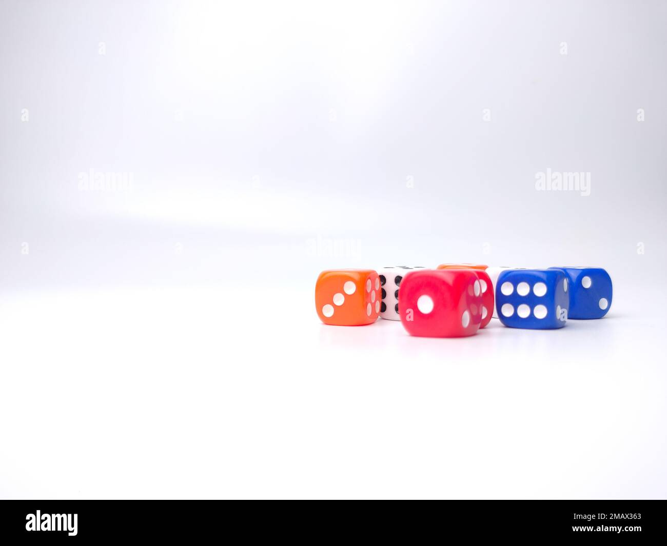 Colored dice isolated on a white background Stock Photo