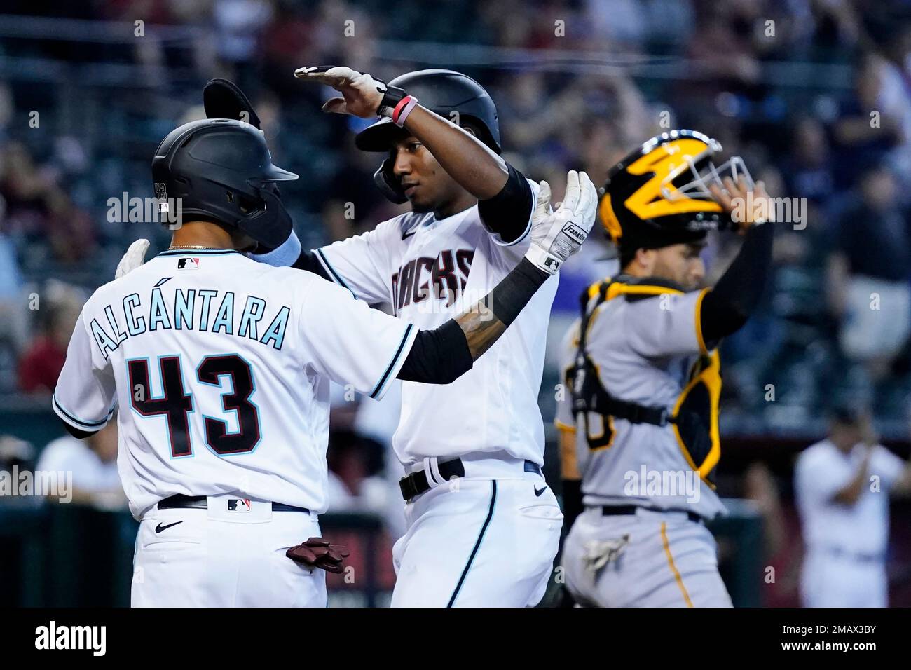 Arizona Diamondbacks' Sergio Alcantara (43) fields a grand out hit by St.  Louis Cardinals Tyler O'Neill during the fourth inning of a baseball game,  Friday, Aug. 19, 2022, in Phoenix. (AP Photo/Matt