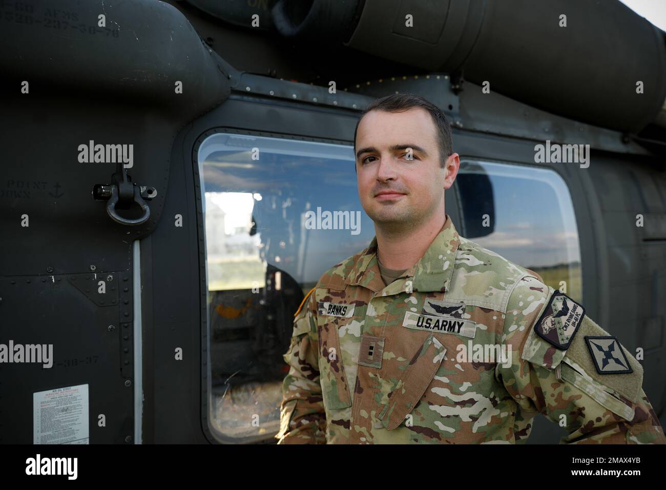 FORT CHAFFEE, ARKANSAS - Today's Soldier of the Day is Chief Warrant Officer 2nd Grade Rynne Banks of Springdale, Ark. Chief Banks is a Medical Evacuation Pilot with G Company 3-238th General Support Aviation Battalion.   Banks and his crew run mission essential casualty evacuation flights for the 39th Infantry Brigade Combat Team and the 77th Combat Aviation Brigade in a UH-60L Blackhawk Helicopter.   When he's not in the air you can find Banks in the lecture hall at UALR where he is a full-time student seeking a Bachelors of Science in Physics. His time in the air and his time in the classro Stock Photo