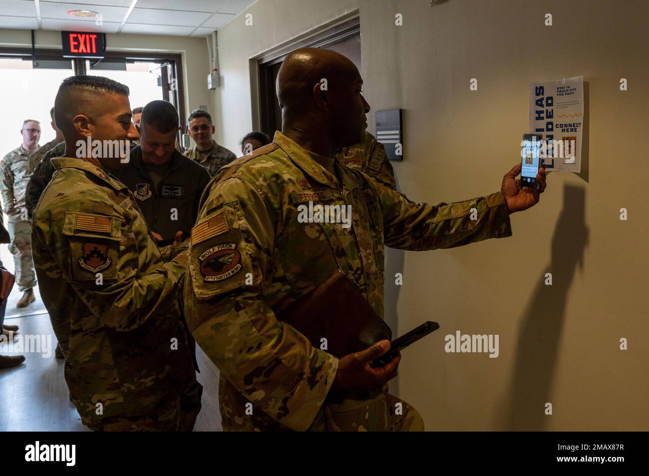 Col. Henry R. Jeffress, III, 8th Fighter Wing Commander, scans a QR code to attach to the base Wi-Fi during an immersion brief on Kunsan Air Base, Republic of Korea, June 6, 2022. The goal of the project is to blanket the installation in free Wi-Fi so that Wolf Pack Airmen can stay connected at any point across the base. Stock Photo