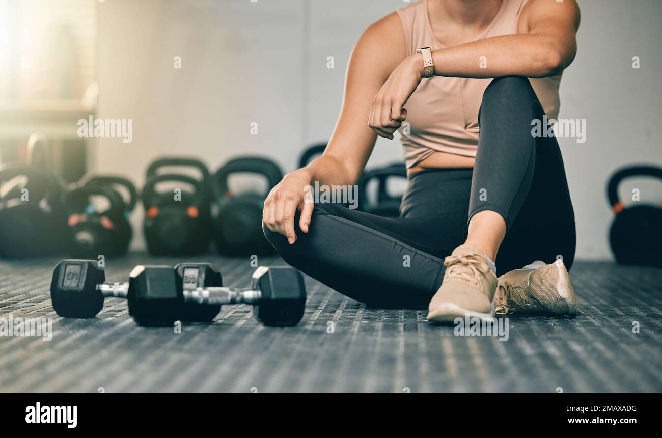 Dumbbells, gym and woman on a health studio club floor ready for training and exercise. Strength challenge, healthy athlete and power workout of an Stock Photo