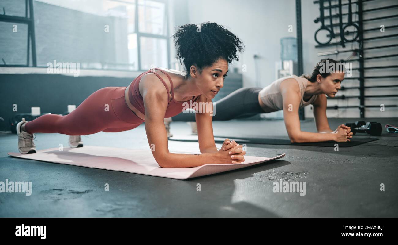Girl friends plank and gym fitness of women doing exercise