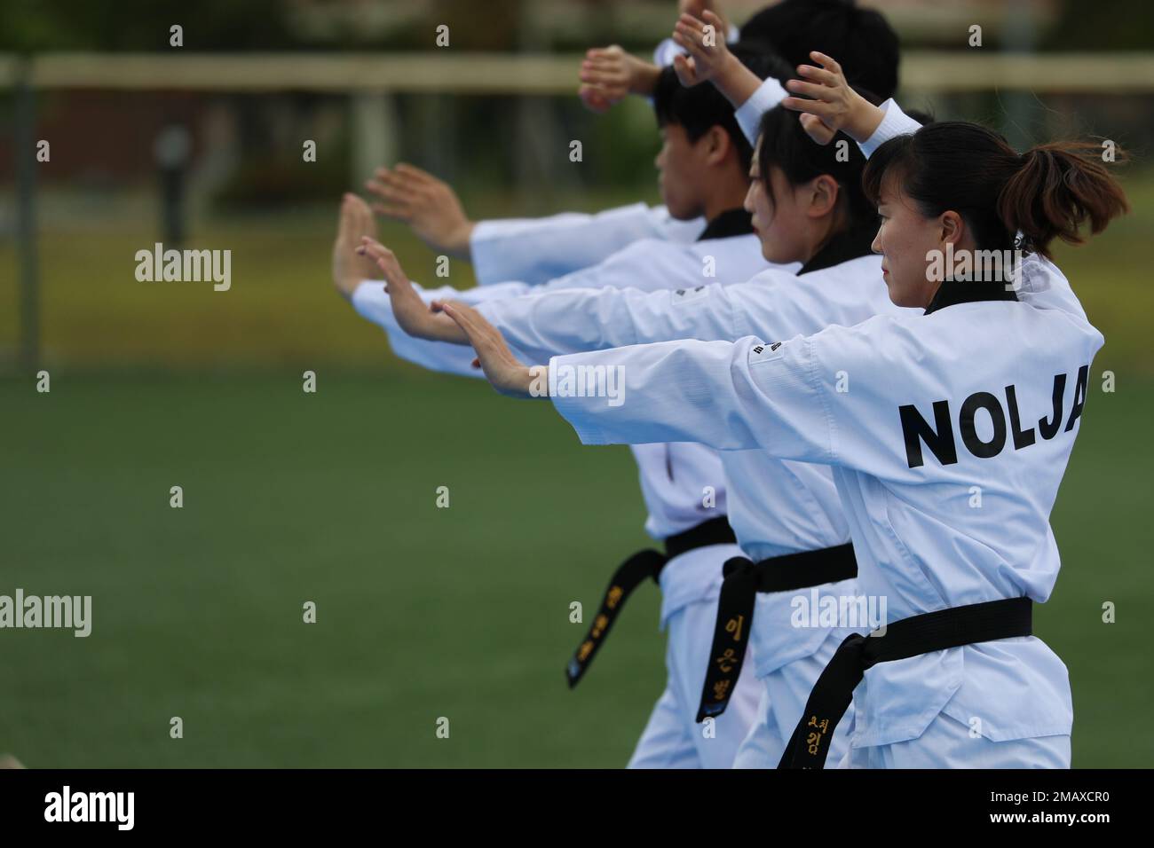 A Korean Taekwondo demonstration team begin the KATUSA Friendship Week ceremony with a martial arts performance on Camp Humphreys, Republic of Korea, 7 June, 2022. KATUSA Friendship Week is hosted annually to facilitate unit cohesion, solidify friendship and foster a cultural understanding between both countries. Stock Photo