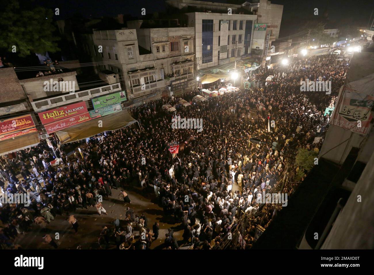 Shiite Muslims participate in a procession to mark Ashoura, in Lahore ...