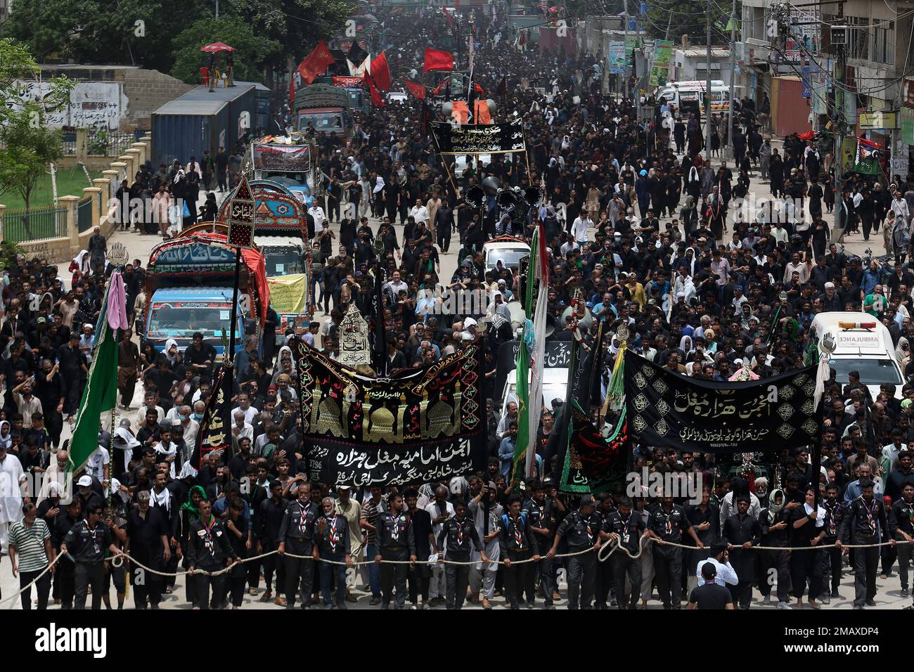 Shiite Muslims participate in a procession to mark Ashoura, in Karachi ...