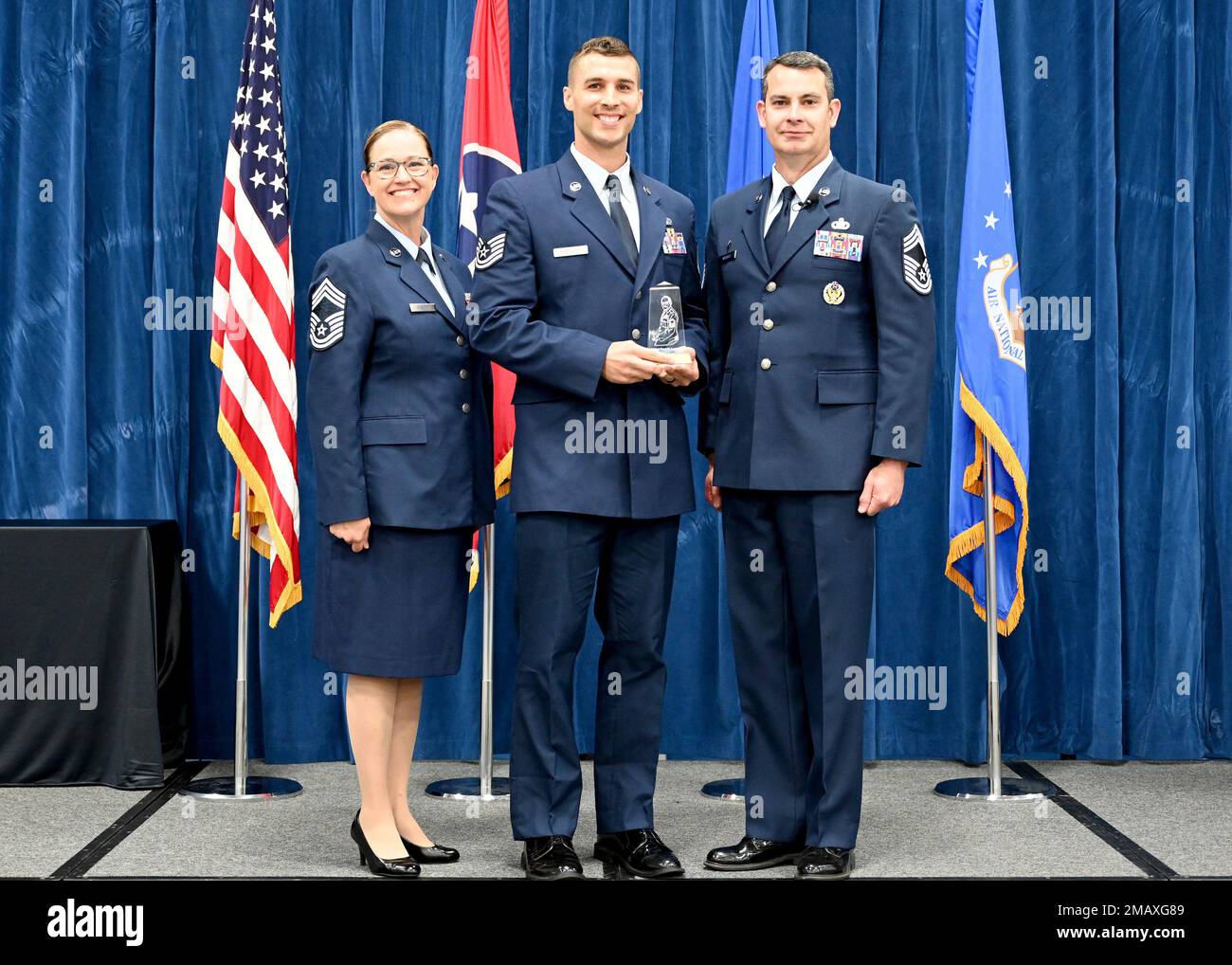 U.S. Air Force Tech. Sgt. Nathan Hartley receives the Commandant Leadership Award during the