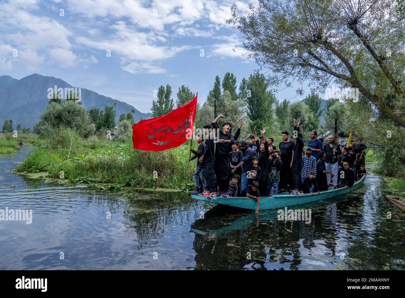 Kashmiri Shiite Muslims shout religious slogans as they participate in ...