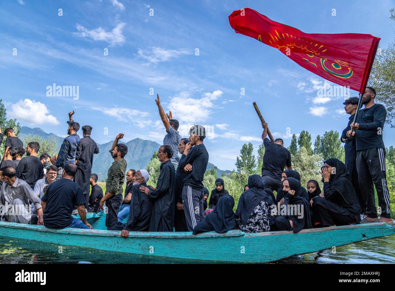Kashmiri Shiite Muslims shout religious slogans as they participate in ...