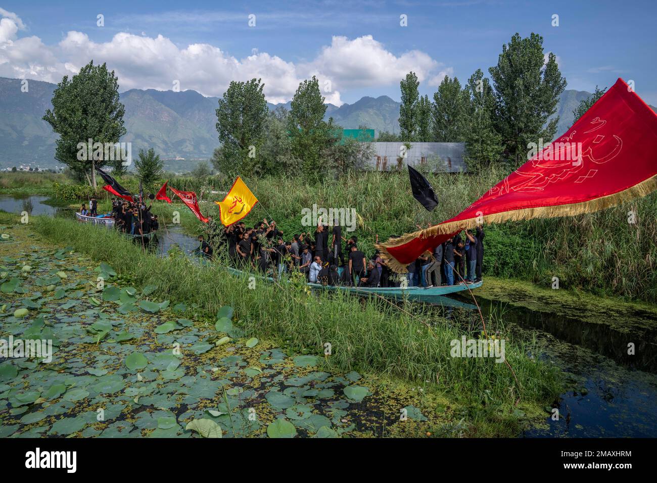 Kashmiri Shiite Muslims shout religious slogans as they participate in ...