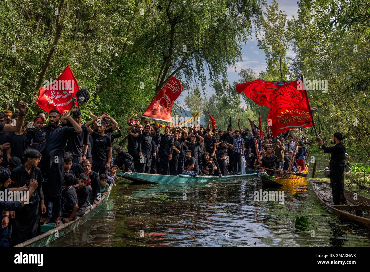 Kashmiri Shiite Muslims shout religious slogans as they participate in ...