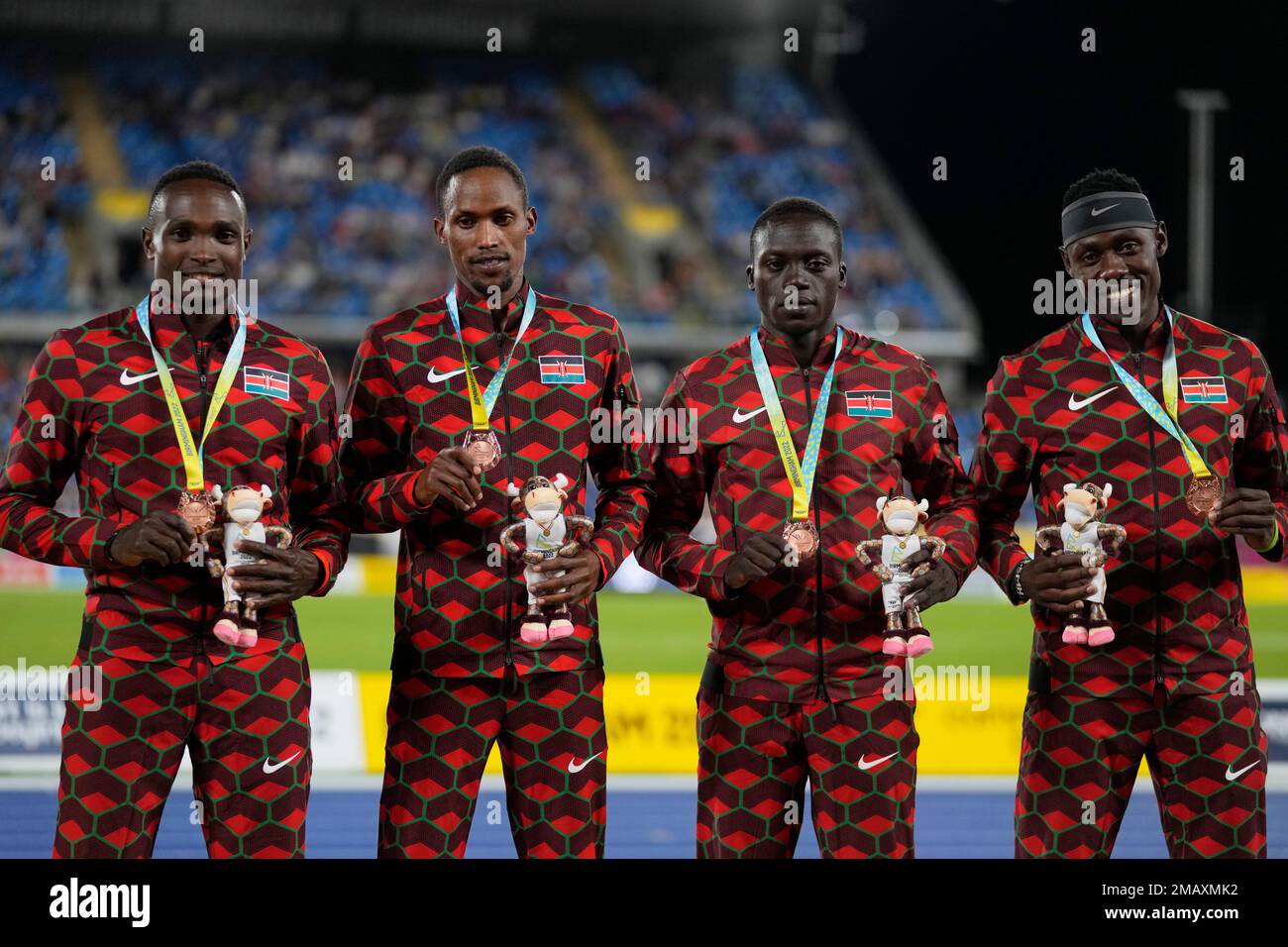 Team Kenya poses on the podium after winning the bronze medal in the