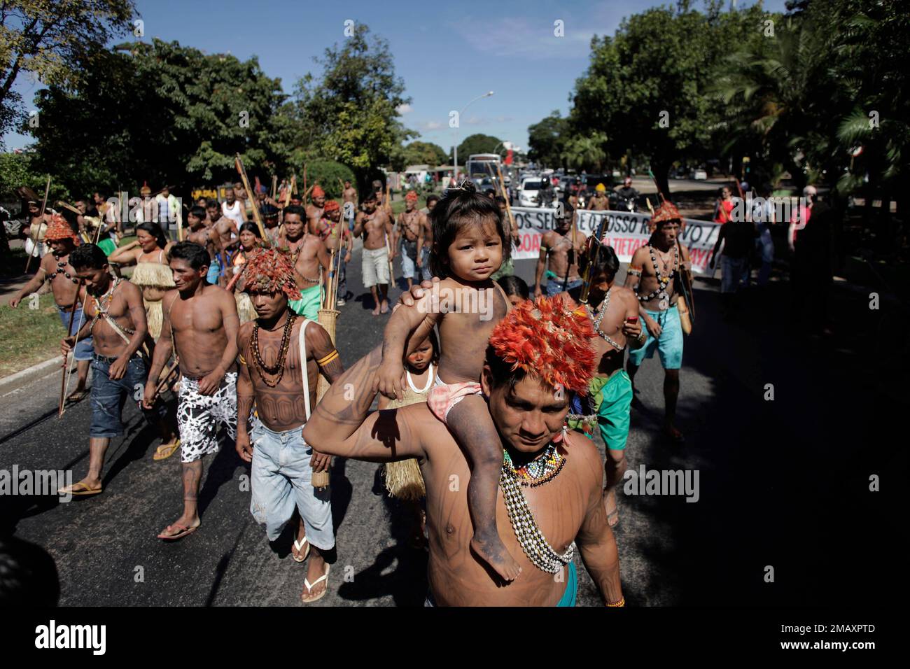 FILE - Munduruku Indians march to the Ministry of Mines and Energy, in  Brasilia, Brazil, June 11, 2013. The group along with other had been  occupying the controversial Belo Monte dam being