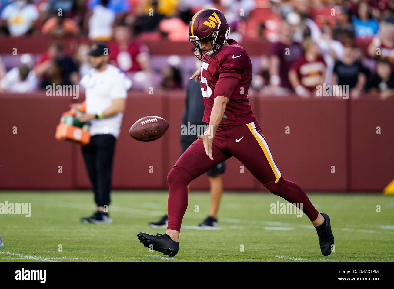 Washington Commanders punter Tress Way (5) punts the ball during an NFL  football practice at FedEx Field, Saturday, Aug. 6, 2022, in Landover, Md.  (AP Photo/Alex Brandon Stock Photo - Alamy